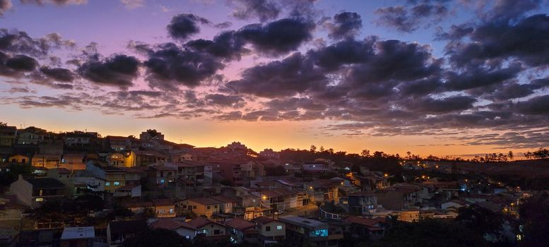 image of colorful sky with dark clouds in late afternoon in Brazil