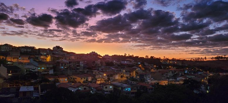 image of colorful sky with dark clouds in late afternoon in Brazil