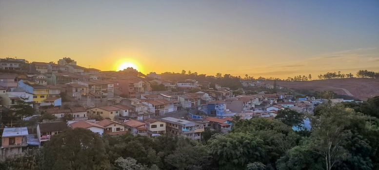 image of colorful sky with dark clouds in late afternoon in Brazil