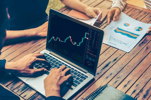 Stock market data chart analysis by ingenious computer software . Investment application display stock market chart on the computer screen and advise trading decision .