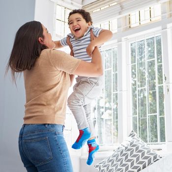 a young mother and son bonding at home.