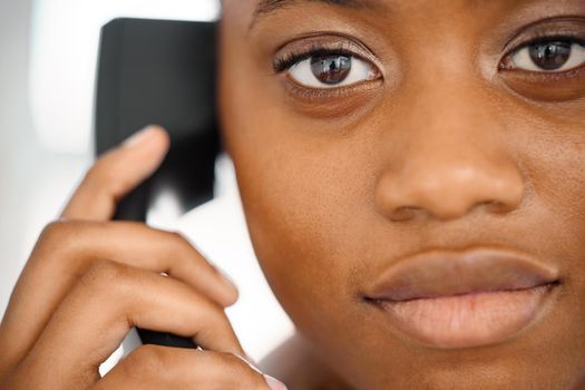 a young woman on a call at work.