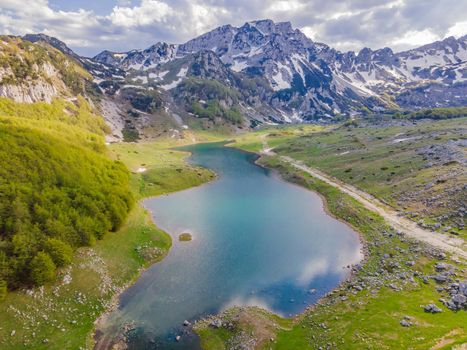 Mountain lake landscape on Durmitor mountain in Montenegro beautiful Durmitor National park with lake glacier and reflecting mountain.