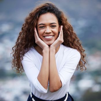 Cropped portrait of an attractive young woman out for an early morning hike in the mountains.