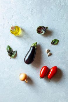 mediterranean cuisine organic vegetables on grey background, top view