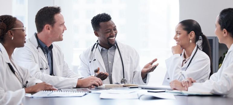 a group of doctors having a staff meeting.