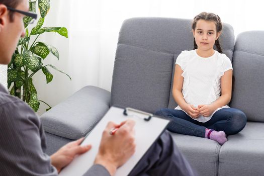 Cute little girl at child psychologist's office