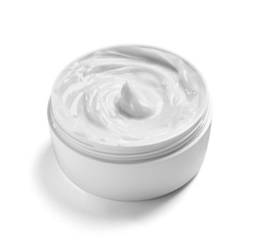 close up of a white beauty cream in a container on white background