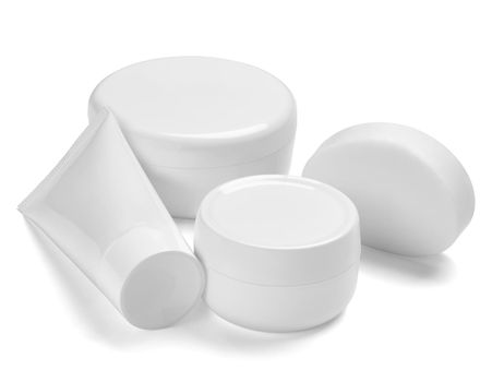 close up of a white beauty cream container and tube on white background