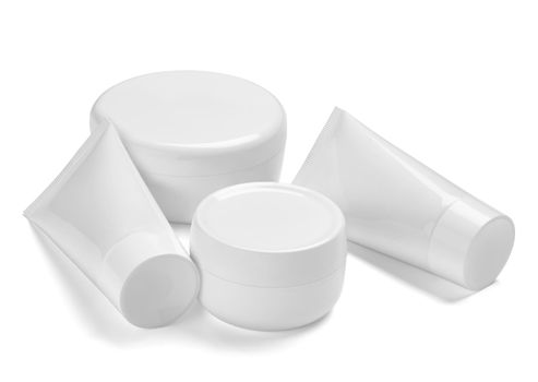 close up of a white beauty cream container and tube on white background