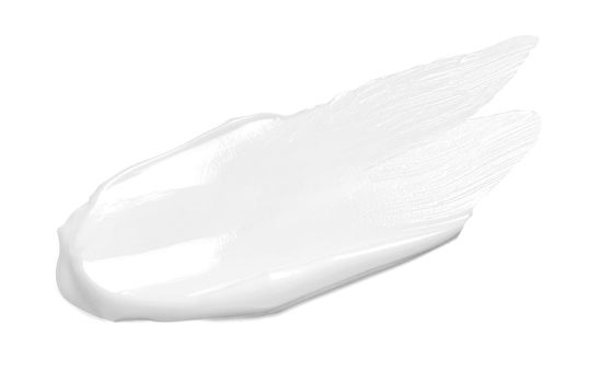 close up of a white cream sample on white background