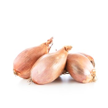 Whole shallots isolated on a white background, with shadow