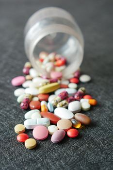 selective focus. Close up of many colorful pills and capsules .