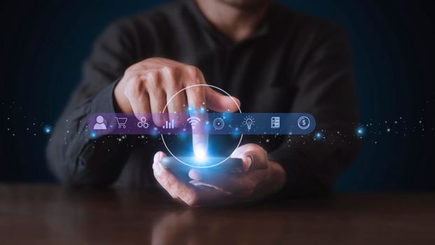 Businessman using phone and touching on virtual screen contact icons. Contact us, Customer support hotline people connect. Man hands touch smartphone virtual screen connect to social network