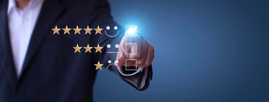Businessman touching the virtual screen check mark joyful Smile face icon to give happiness in service. Customer service and satisfaction concept. Very impressed with the rating. With copy space banner