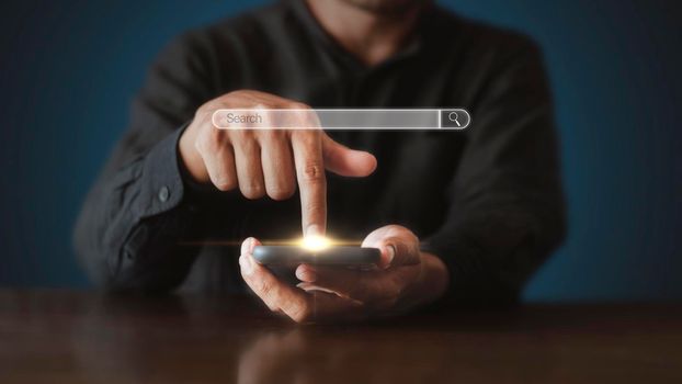 Hand man using mobile phone with search bar connect to social media, social network Online marketing concept Man hand holding smartphone with search bar Lifestyle business concept copy space banner