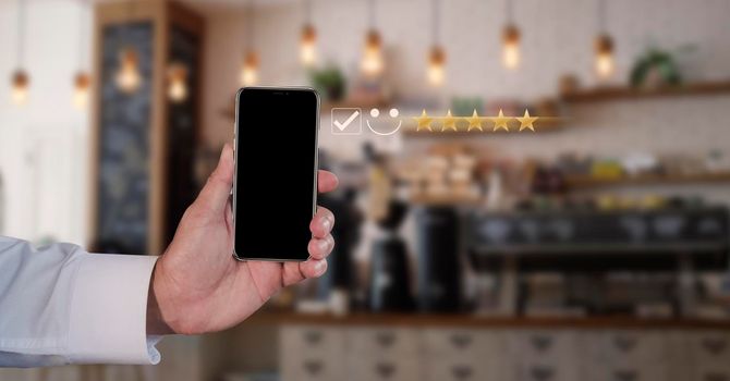 Businessman use the virtual screen check mark joyful Smile face icon to give happiness in service. Customer service and satisfaction concept. Very impressed with the rating.