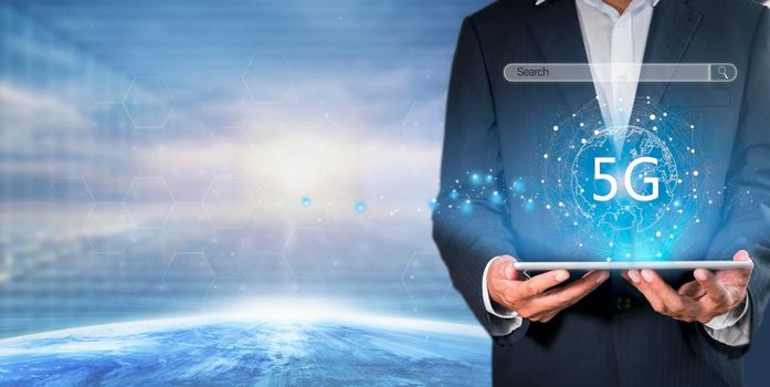Hand of business man hold tablet connect network 5G with icon concept, technology network wireless systems and internet of things, new technologies coming up in the future. Network connection 5G