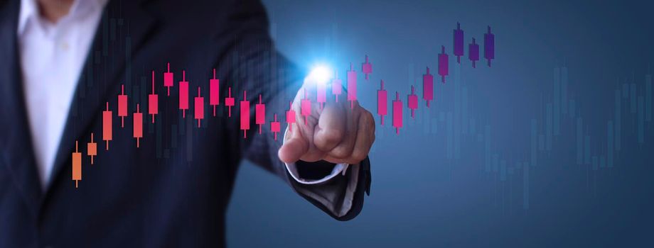 Businessman show stock market bar chart grow up to target. Business finance concept. Businessman's hands Show success graph, stocks grow every year  With copy space banner