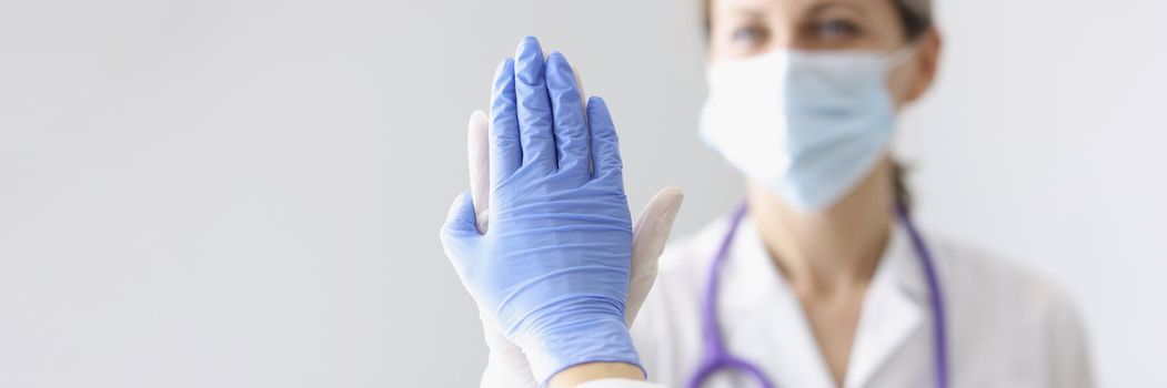 Portrait of medical coworkers give high five after successful surgery or diagnose to patient. Good job, well done gesture, celebrate win. Medicine concept