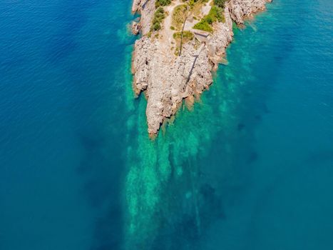 The pipe drains the sewer into the sea. Environmental pollution. Drone view.