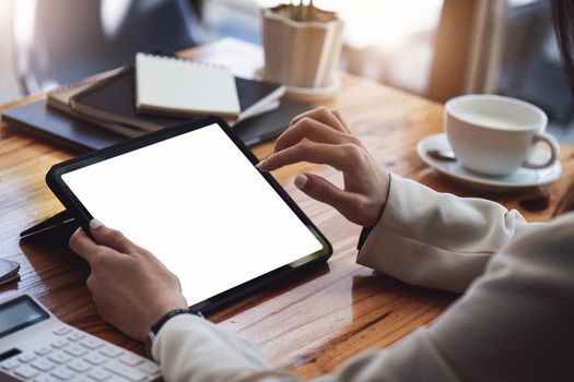 business woman of financial consultant using digital tablet touchpad computer. tablet blank screen mockup.