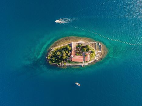 Aerophotography. View from flying drone. St George Island in the Bay of Kotor at Perast in Montenegro, with St George Benedictine Monastery. St. George Island, is a small natural island off the coast.