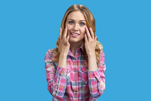 Beautiful young woman in stylish shirt posing on color background. Charming woman model posing at camera.