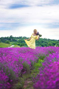 Beautiful woman in lavender field. Selective focus. Nature.