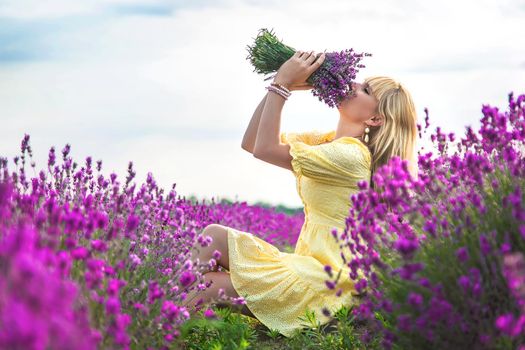 Beautiful woman in lavender field. Selective focus. Nature.