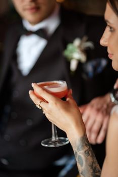 bride and groom inside a cocktail bar in a vibrant atmosphere