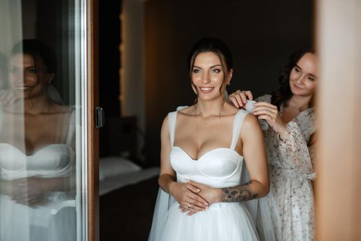 bride in a white dress at the training camp inside the hotel