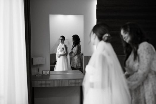 bride in a white dress at the training camp inside the hotel