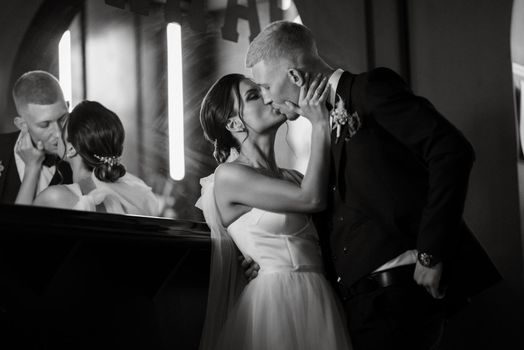 bride and groom inside a cocktail bar in a vibrant atmosphere