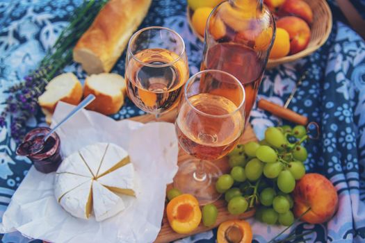 Wine in a lavender field. Selective focus. Food. Food.