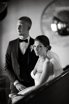 bride and groom inside a cocktail bar in a vibrant atmosphere