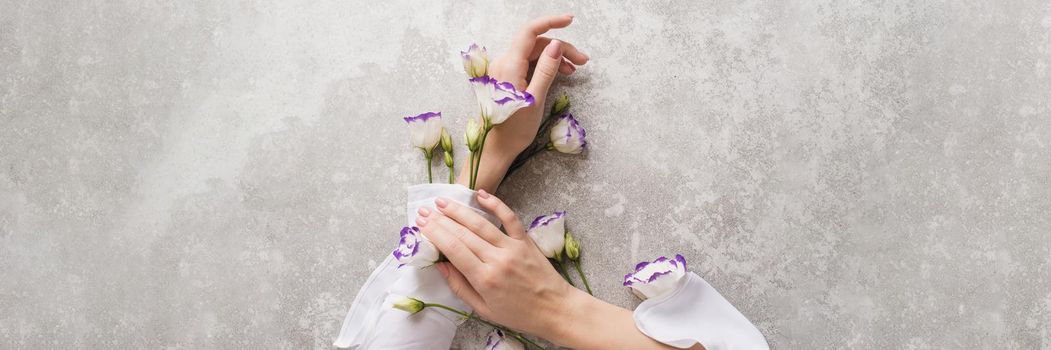 Creative illustration of hand skin care, natural cosmetics components. Hands of a cute girl with light white sleeves with flowering plants. Web banner