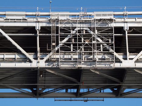 Close up of San Francisco Bay Bridge middle section of double deck roadway on a clear blue day.