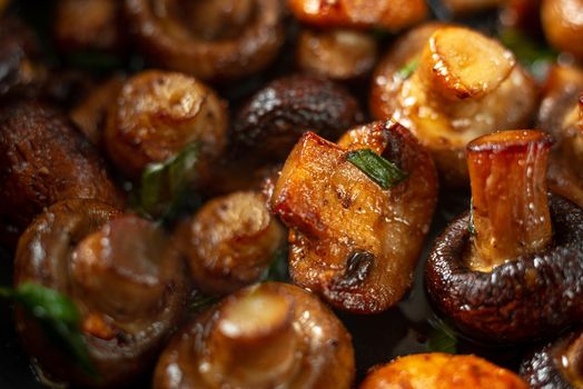 pan fried rustic mushrooms. Mushrooms fried in sunflower oil close-up
