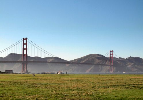 view of golden gate bridge from crissy field with marin county over the bay 