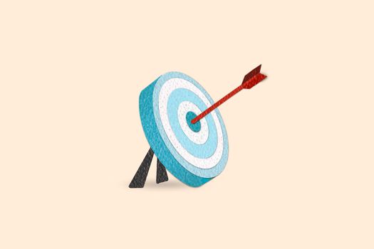 Paper cut style minimal blue arrow hit the center of target. Metaphor to goal of success. Business target achievement concept.