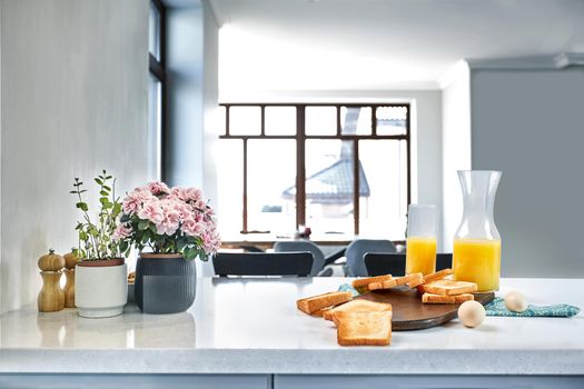 Continental breakfast - orange juice and toast on white table. Background with free text space.