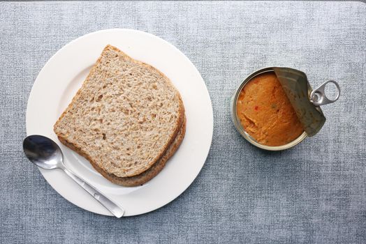 canned tuna on wooden table