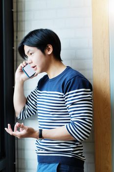 vintage tone with Businessman using a mobile phone to work look at sales graphs make a profit from his business.