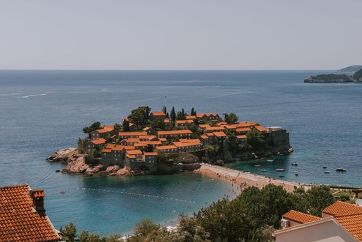 Sveti Stefan is a small isand on Adriatic coast of Montenegro near of Budva. Resort is known commercially as Aman Sveti Stefan. Sveti Stefan, Adriatic sea, Europe. Sveti Stefan peninsula on the Adriatic Sea in Budva, Montenegro
