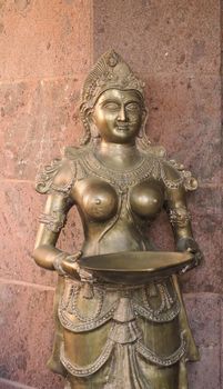 ancient golden statue of traditional indian goddess