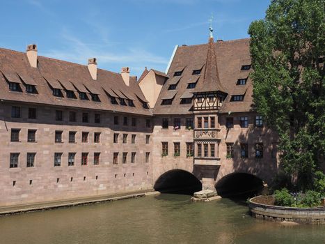 Heilig Geist Spital translation Holy Spirit Hospital on Pegnitz River in Nuernberg, Germany