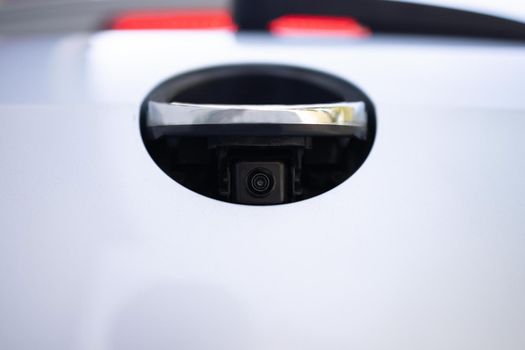 Rear view camera. Luxury back car rear view camera for parking assistance. Concept of safety car driving while parking process. Assist device equipment in modern electric cars