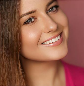 Beauty, makeup and skincare cosmetics model face portrait on pink background, smiling woman with natural makeup, perfect healthy teeth, dental care closeup