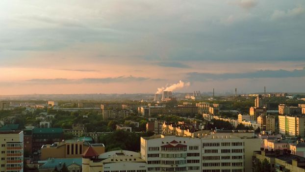 Evening sunlight falls on a large industrial city